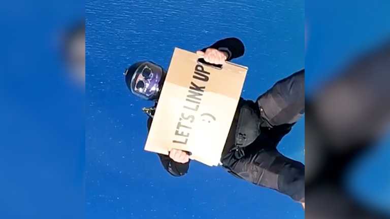 Job seeker lands dream role after jumping out of a plane with a cardboard sign asking for work Job seeker lands dream role after jumping out of a plane with a cardboard sign asking for work